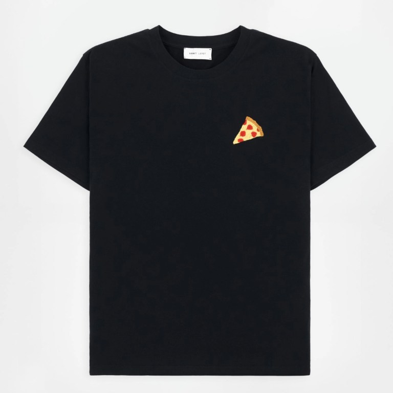 A black short sleeve t-shirt with an embroidered slice of pizza on the front on a plain background