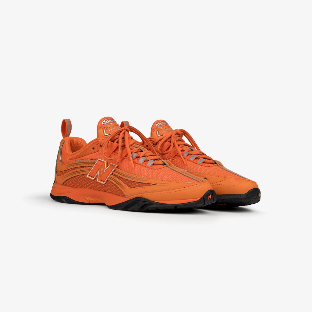 A pair of Aimé Leon Dore's version of the New Balance RC56 sneaker in orange
