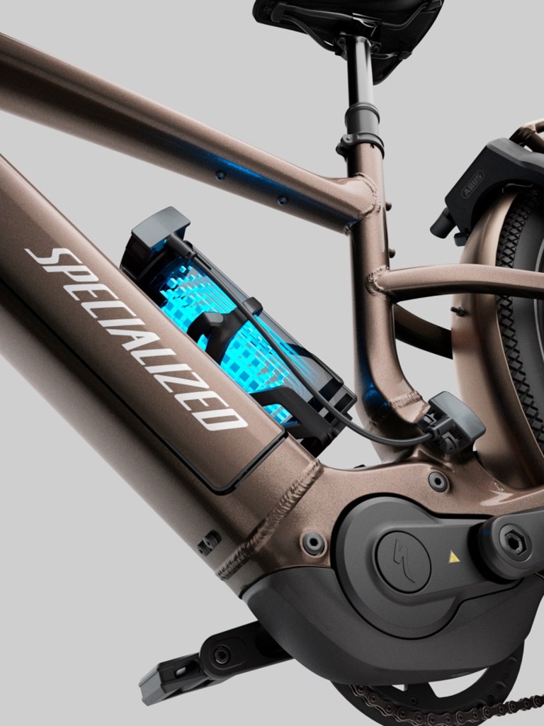 A detail of a glowing blue battery on the Specialized Vado 3 EVO.