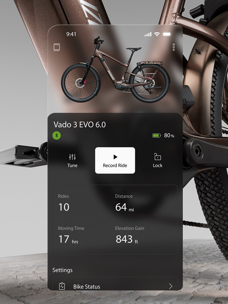 A sample screen of the Specialized Vado app overlaying a bike image.