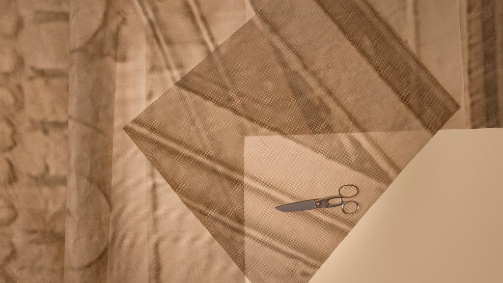 A graphic showing forms patterns and a scissor