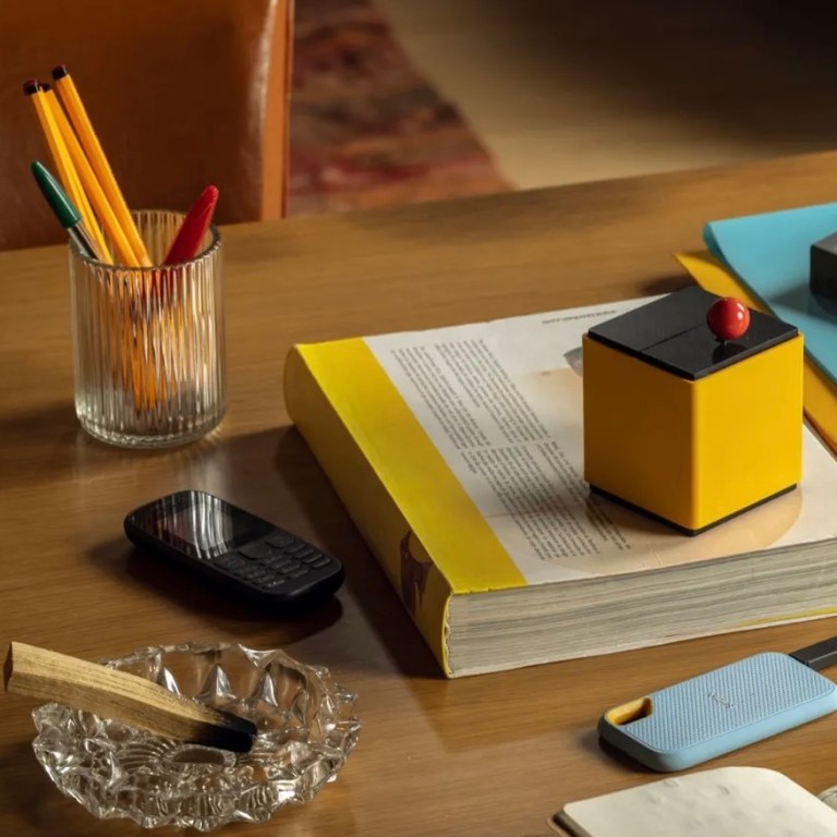 A La Machine rests on top of a desk