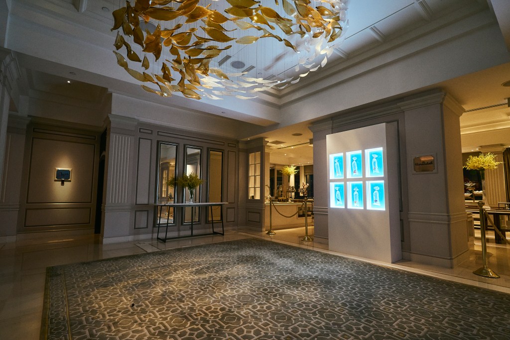 One element of Angel Hui's "Swimming in Nature" features six physical works mounted in front of a restaurant