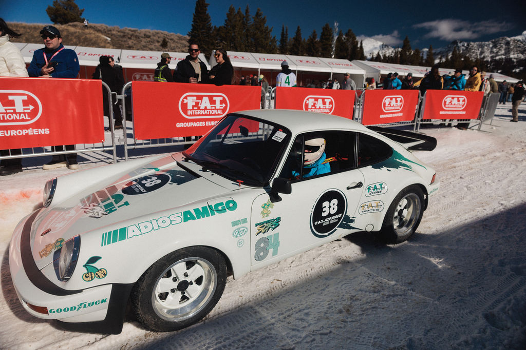 A driver in a white car at FAT Ice Race in Big Sky, Montana.