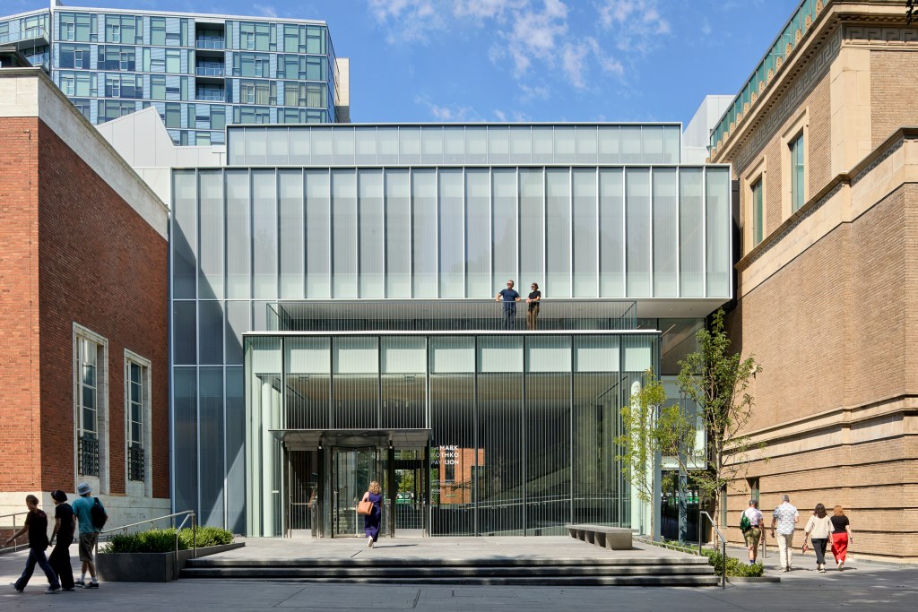 The glass Mark Rothko Pavilion at the Portland Art Museum with people walking nearby.