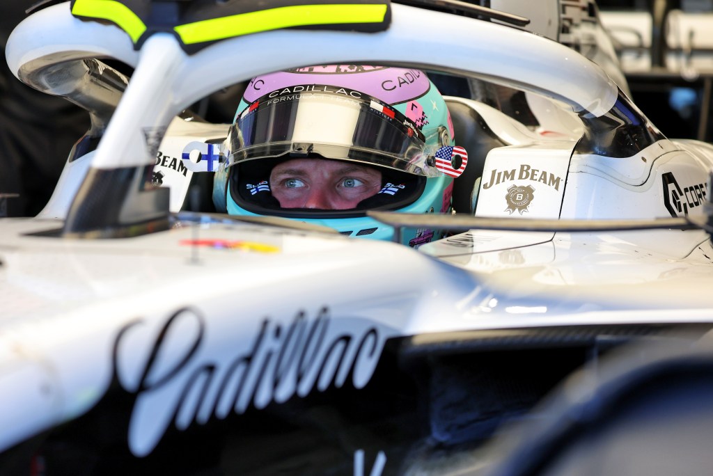 A tight shot of Valtteri Bottas of Cadillac Formula 1 Team, sitting in his car with wide-open blue eyes.