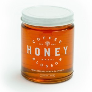 A jar of Coffee Blossom Honey on a white background