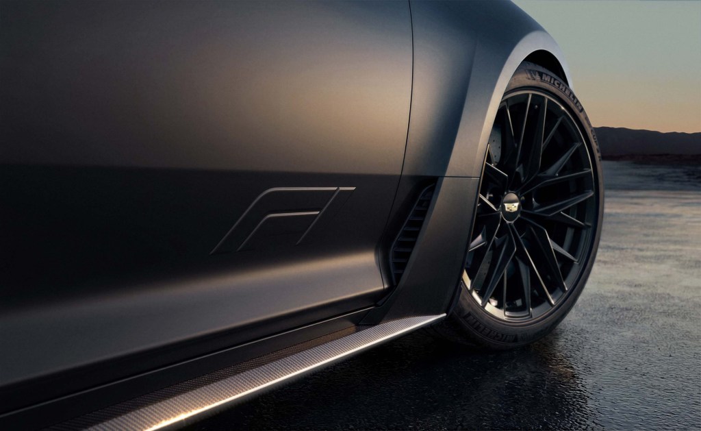 A detail of a side door of the Cardillac CT5 Blackwing F1 edition, showing a minmal "F1" emblem.