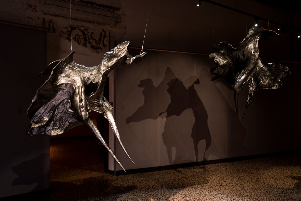 Three hanging titanium sculptures at Bovolo Tower.