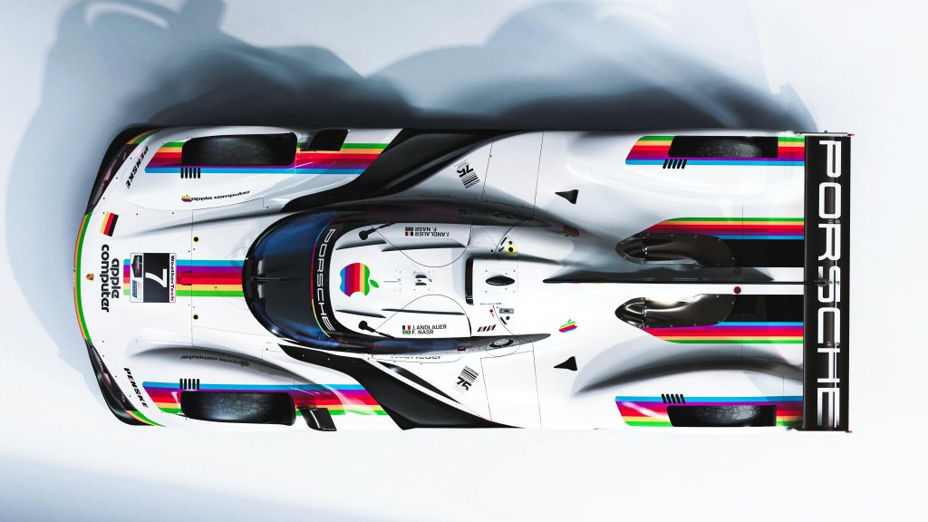 An overhead shot of a Porsche racecar adorned with vintage Apple Computer graphics.