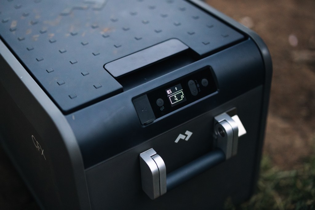 A detail of a CFX5 Dometic cooler showing the top and the side panel with internal temperature display.