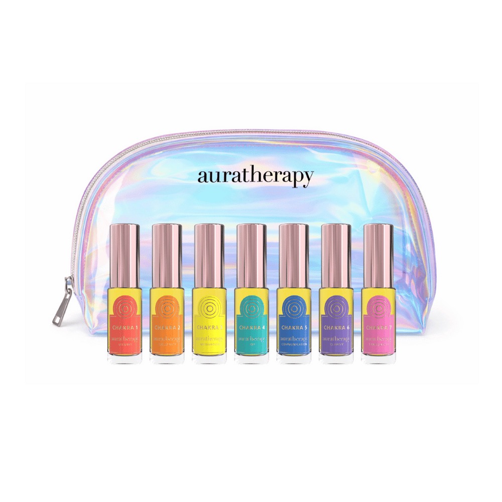 Seven vials of Auratherapy's Chakra Boost Discovery Kit are shown in front of a holographic pouch
