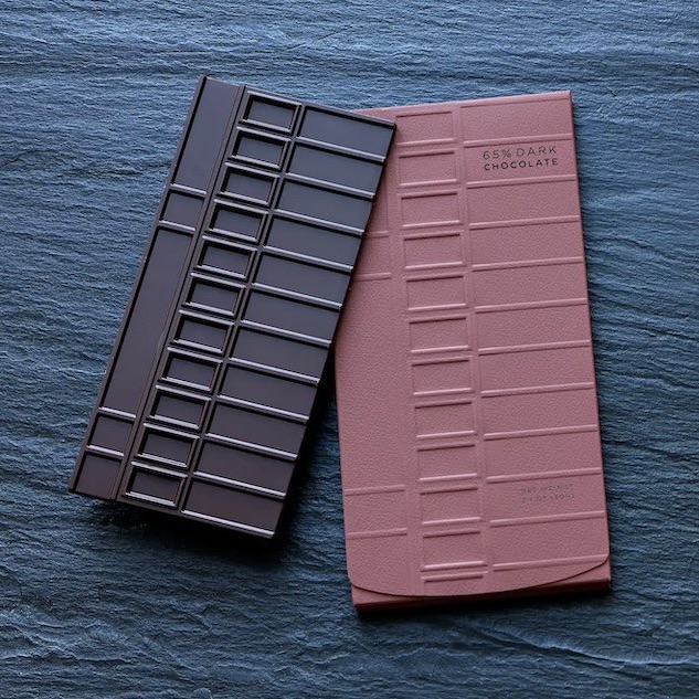 A package and bar of Éclat Chocolate's 65% dark chocolate bar, inspired by the shape of the windows in Frank Lloyd Wright's famous Fallingwater House