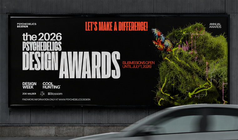 A mockup of a black, horizontal Psychedelics Design Awards poster hanging on a city street with a moving car in the bottom right corner of the frame.