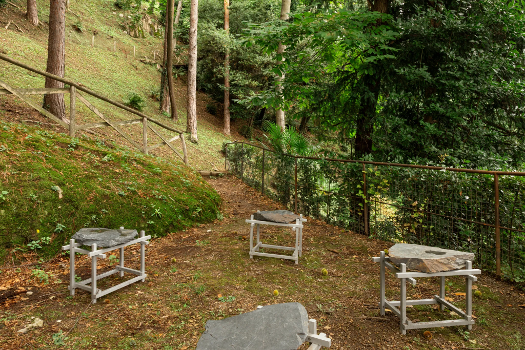 An exhibition of metal stools displayed outside at 2025's Lake Como Design Festival.