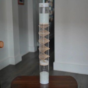 Spiral Sounds'' 24" rainstick shows small beads in a tube and the wooden lattice structure inside