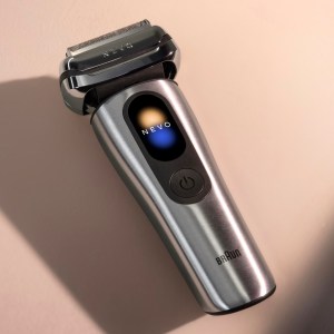 Braun's new Nevo electric shaver is shown on a tan background