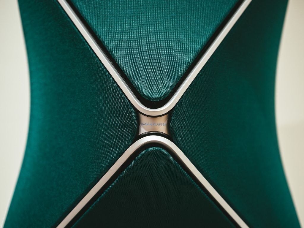 A detail of a green Bang & Olufsen speaker.
