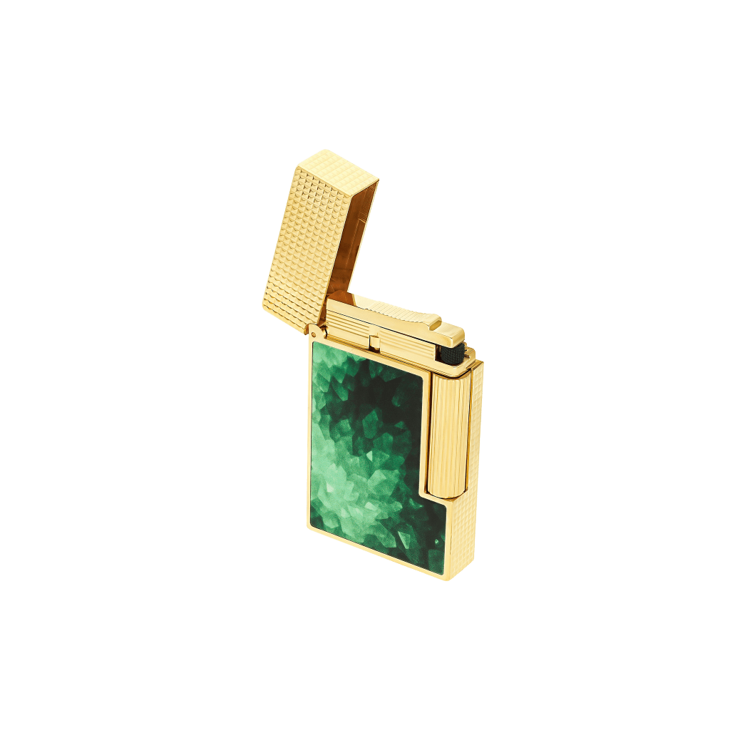 A gold ST Dupont Geode lighter features green enamel