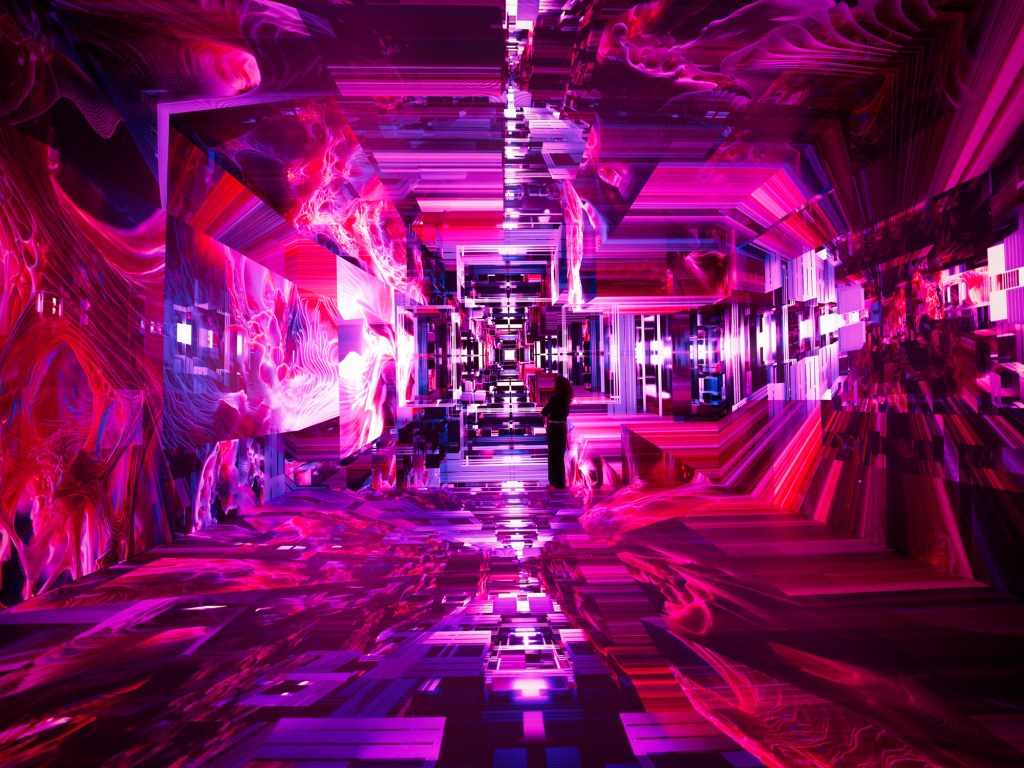 A pink room with AI graphics projecting on to the floor, ceiling and walls.