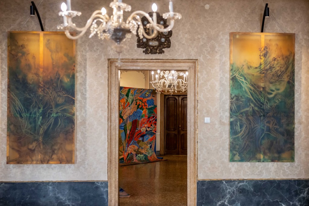 Two paintings by KV Duong flanking a doorway in the Nani Bernardo Palace.