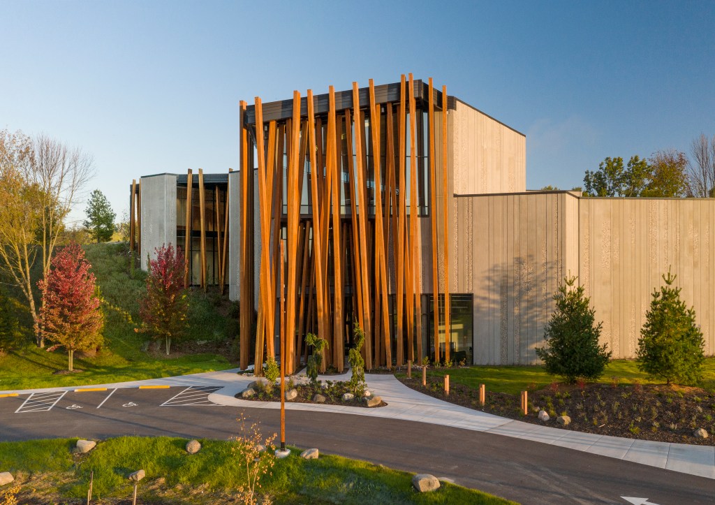 An exterior view of the John Michael Kohler Art Preserve with a blue sky background.