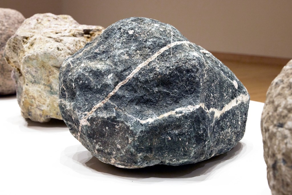 A detail of a few larger rocks, part of "Rock Fade (≈ 45 Billion Years)," by Lenka Clayton and Phillip Andrew Lewis.