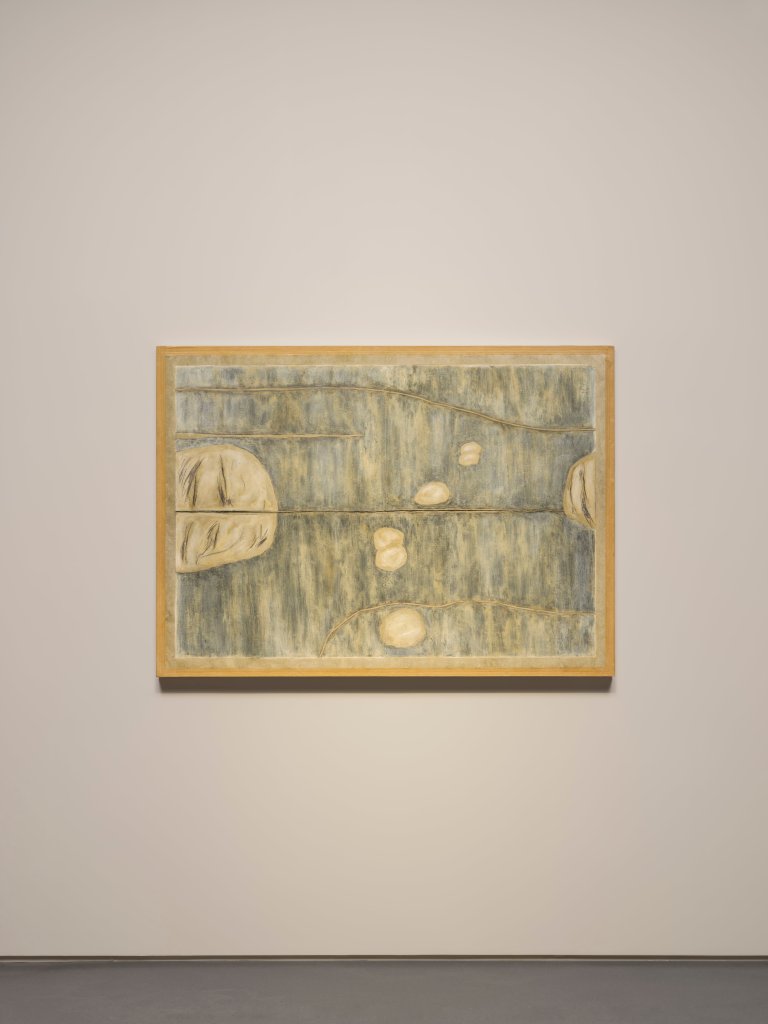 A cream and gray artwork by Huong Dodinh hanging on a white wall. 