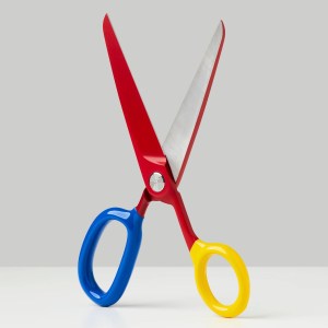 A pair of Craghill's ceramic coated scissors with vinyl dipped handles, shown in red, blue and yellow