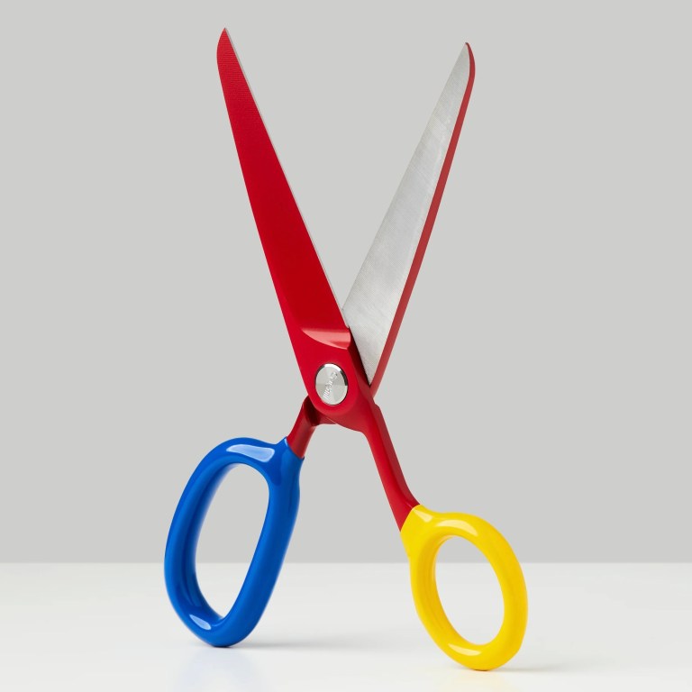 A pair of Craghill's ceramic coated scissors with vinyl dipped handles, shown in red, blue and yellow