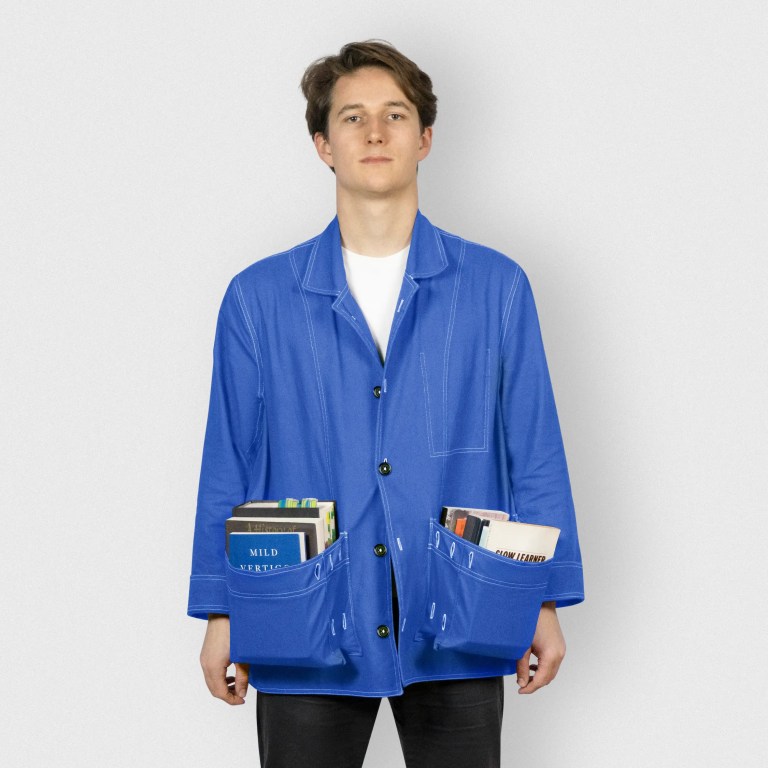 The Slow Learner Dust Jacket, shown in blue, on a male model