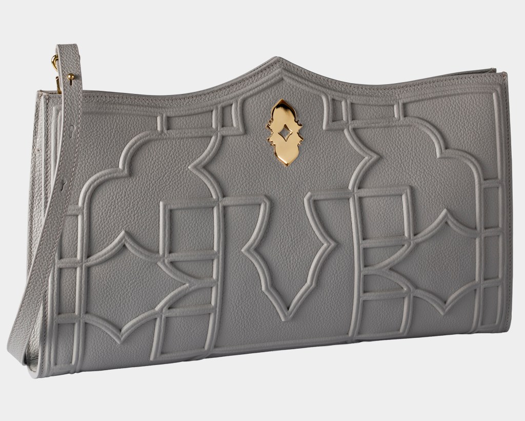 A gray Dellaluna Louvre Abu Dhabi handbag shot on a slight angle on a white background.