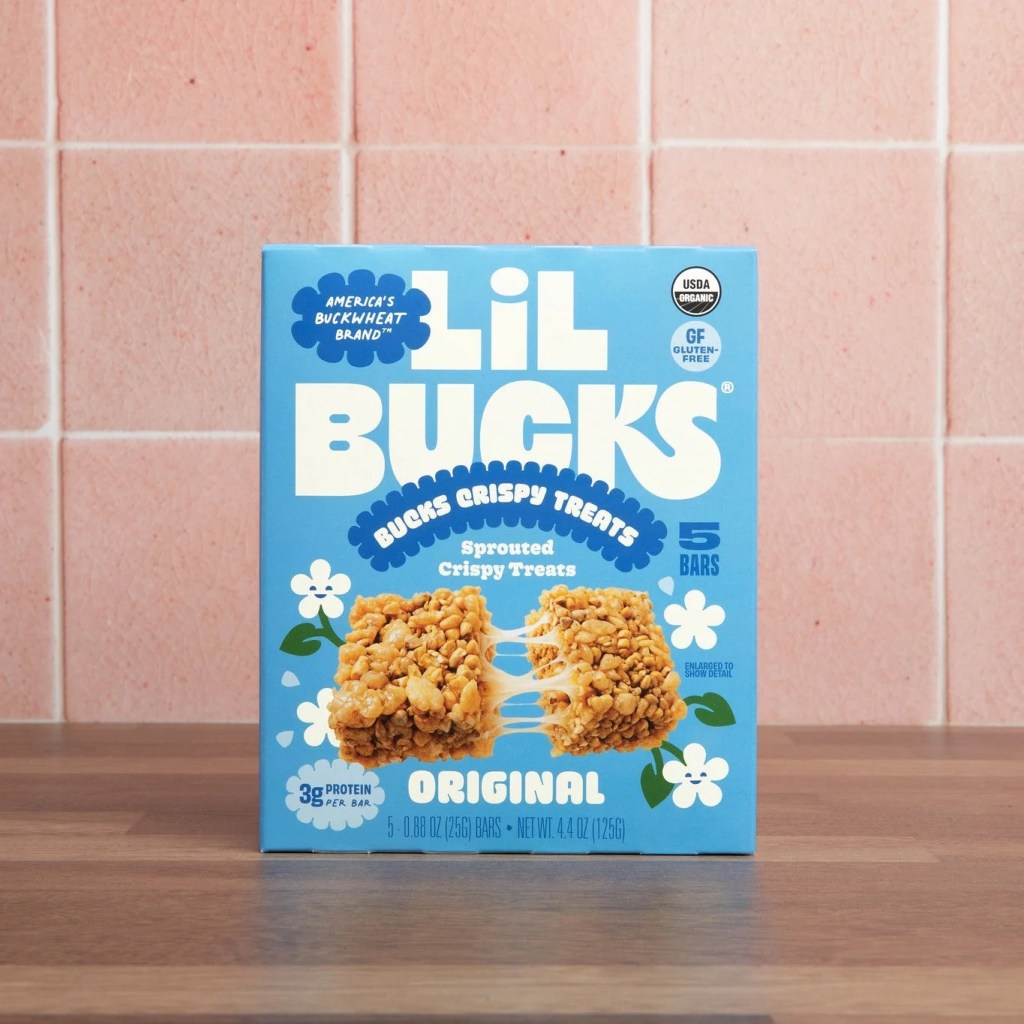 A box of Little Bucks Crispy Treats on a counter witha tile background