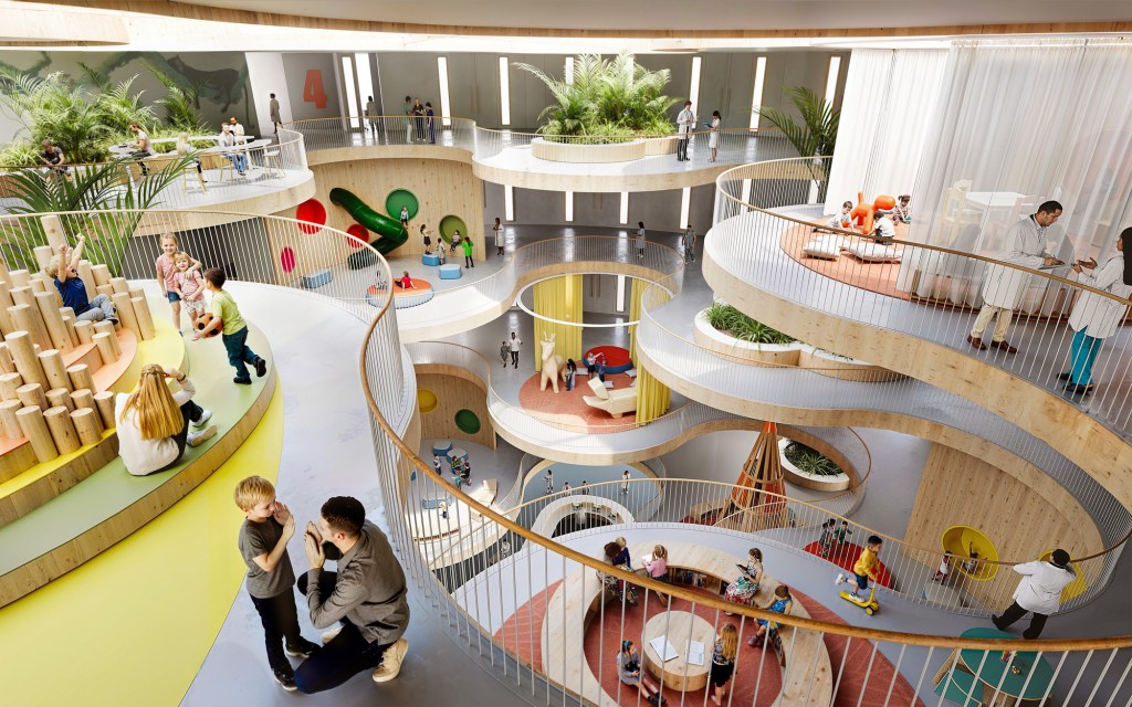 A rendering of a children's hospital lobby with multiple levels of open spaces showing adults and children playing.