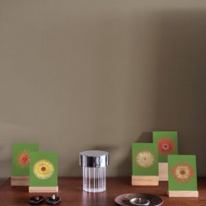 Bienvenue Studios small print collection postcard set displayed on a table