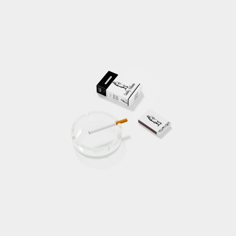 A box of Smoky Paoloma's incense, which looks like a pack of cigarettes, is shown with one cigarette-looking incense stick in an ashtray, and a mathbox