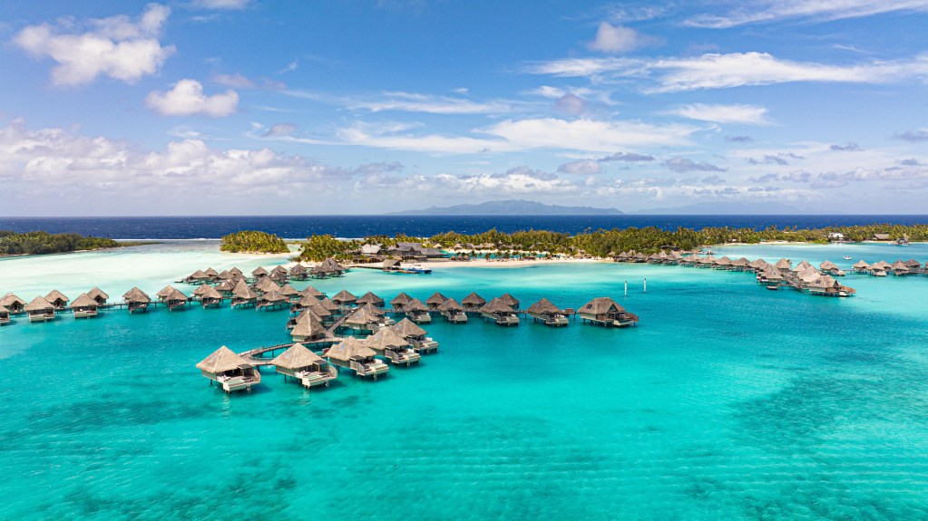 An aerial shot of the bungalows in the lagoon at The Westin Bora Bora Resort & Spa.