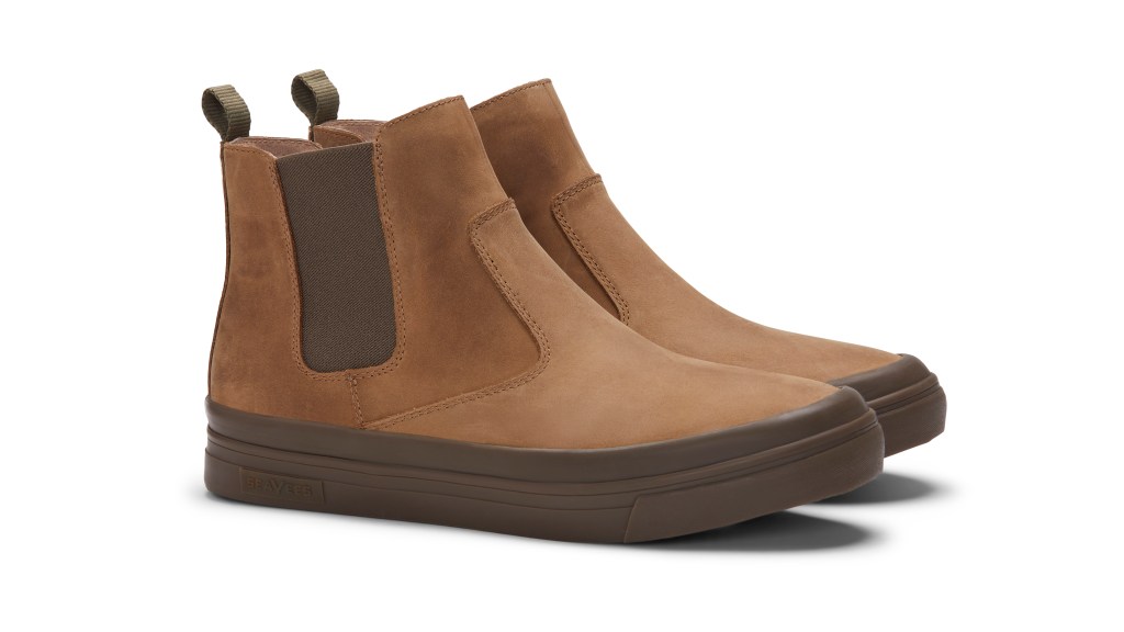 A 3/4 shot of a pair of brown Beyond and Back boots on a white background.