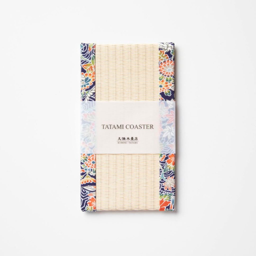 A rectangular shaped tatami mat used for mobile phones with a patterned fabric border