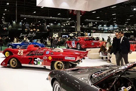 People looking at vintage cars at Rétromobile 2025