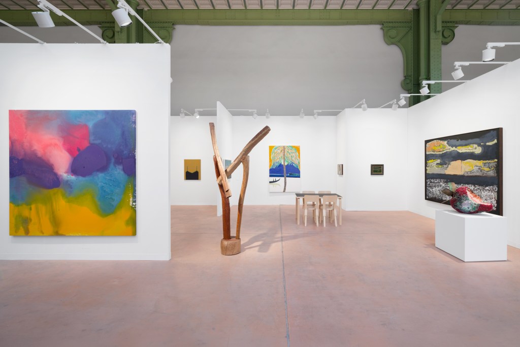 An installation view of Karma's booth at Art Basel Paris with a variety of hung and sculptural works.
