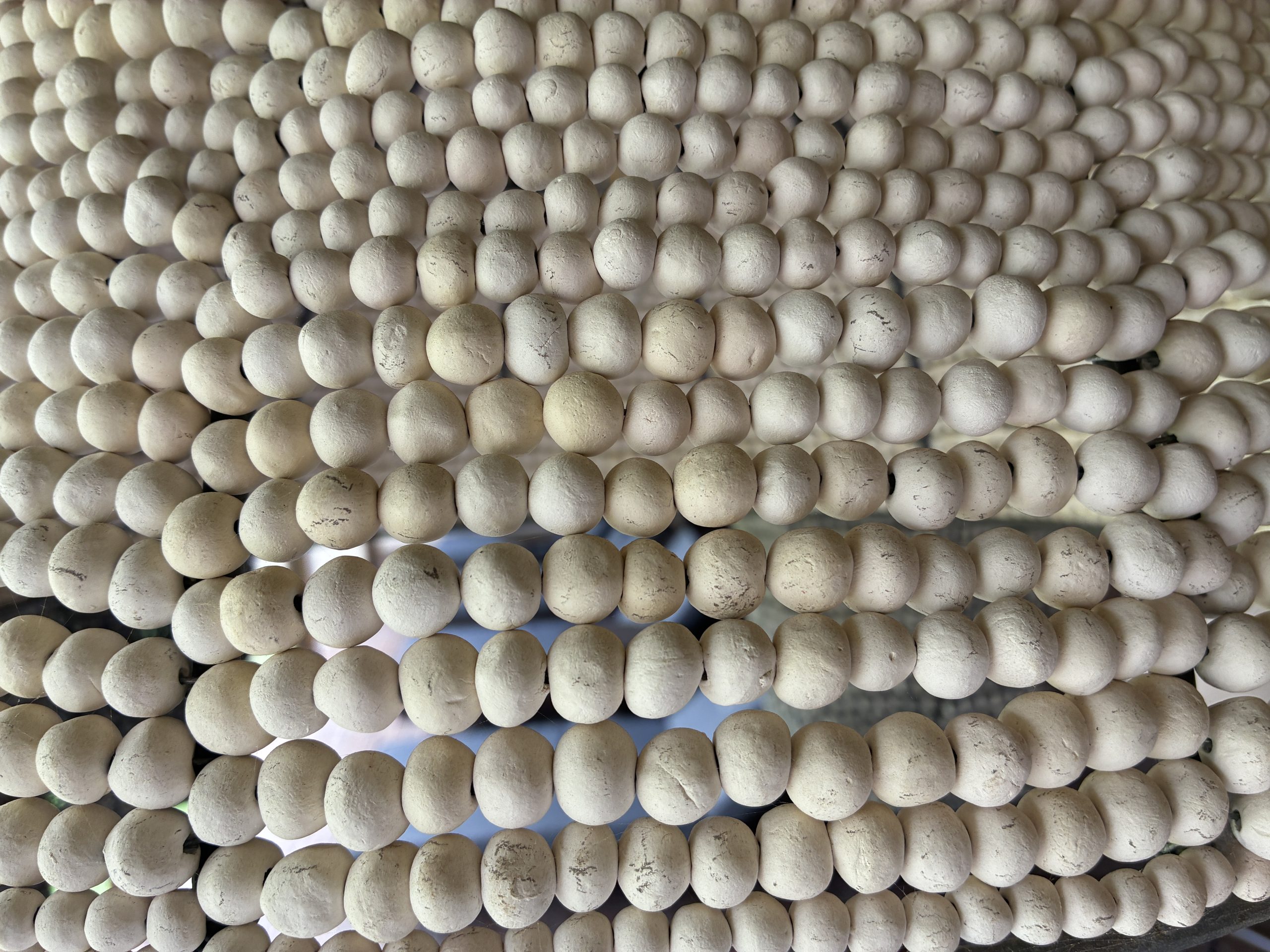 A detail of a hand-rolled bead chandelier in a guest room at Kitirua Plains Lodge.